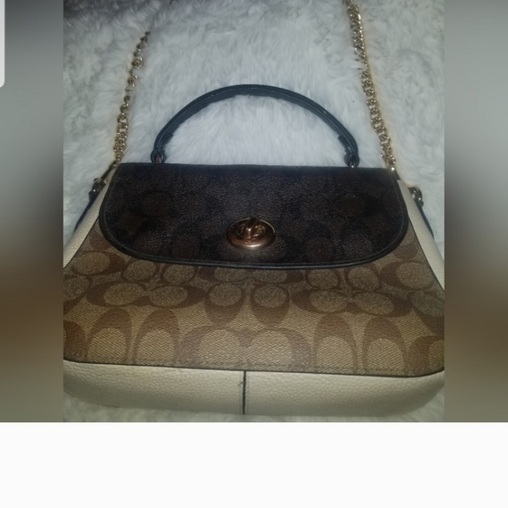 Coach Marlie top handal handbag.  Eye catching gold and leather strap